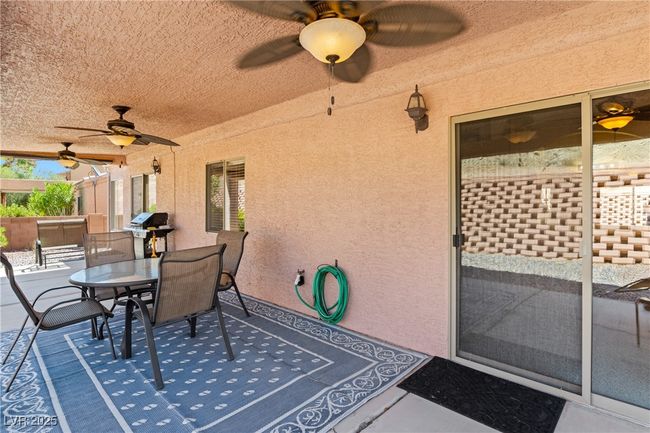 View of patio / terrace with ceiling fan, outdoor dining space, and grilling area | Image 42