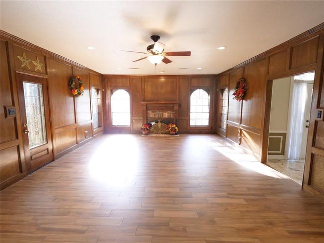 Spacious living area with fireplace | Image 13