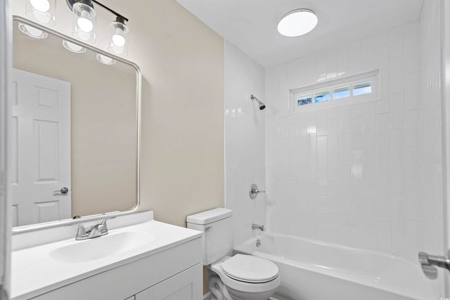 Bathroom with bathtub / shower combination and vanity | Image 25