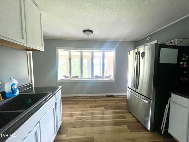 Bay window looking into sunroom. | Image 7