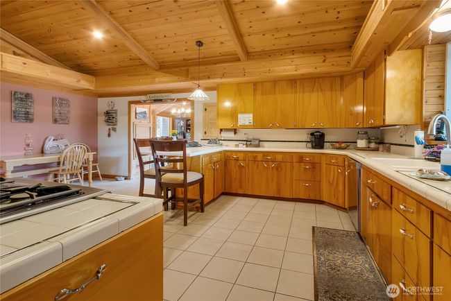 Kitchen with room for table, looking towards the dining room | Image 10