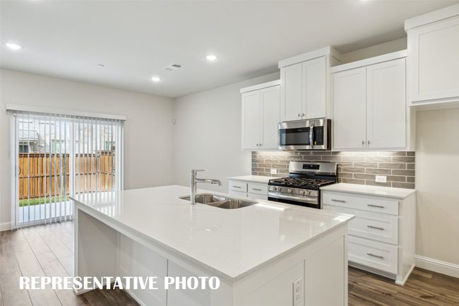 Light, bright and airy, this open concept kitchen-dining- area is everything you have been searching for! REPRESENTATIVE PHOTO | Image 7