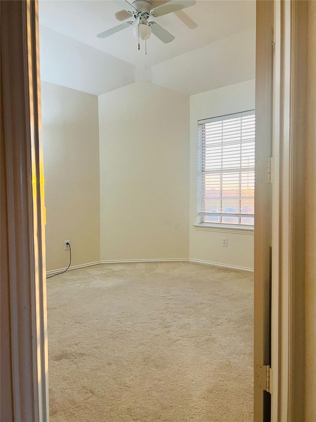 Bedroom with ceiling fan and light colored carpet | Image 21