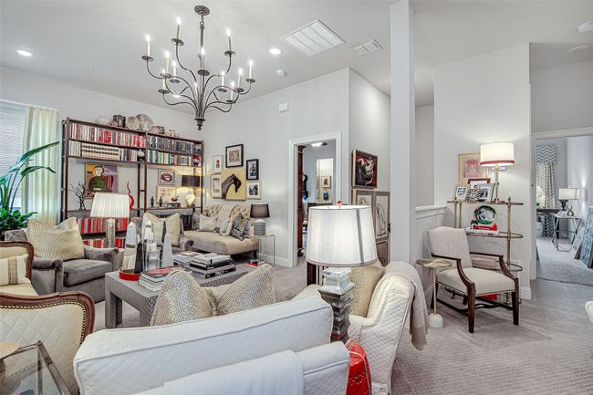 Living room with an inviting chandelier, visible vents, recessed lighting, carpet floors, and baseboards | Image 24