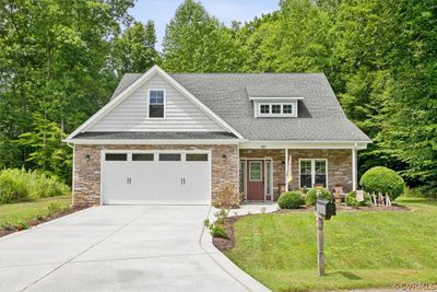 Craftsman-style home with a front lawn | Image 1