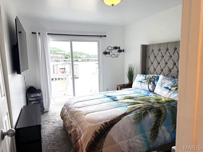 Carpeted bedroom featuring access to exterior | Image 28