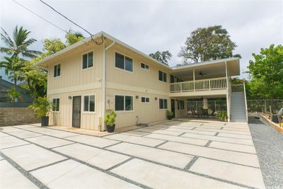 City and County easement behind the home. Past the trees is the Midpac Golf course-no access. Windsurfer on left side of property. Empty lot to the right of the property is waiting for his permit to build a new home. | Image 1