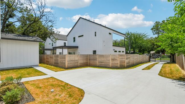 View of community with concrete driveway | Image 29