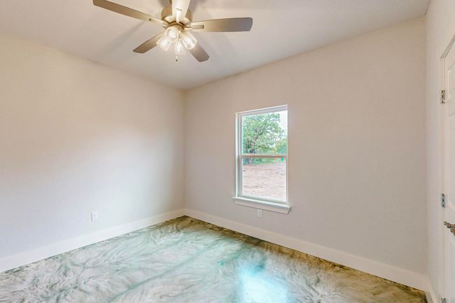 Spare room with baseboards and a ceiling fan | Image 36