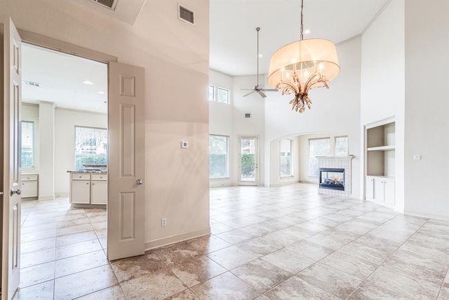 View from dining area into kitchen and living space. Fabulous open flow perfect for entertaining and functional living. | Image 15