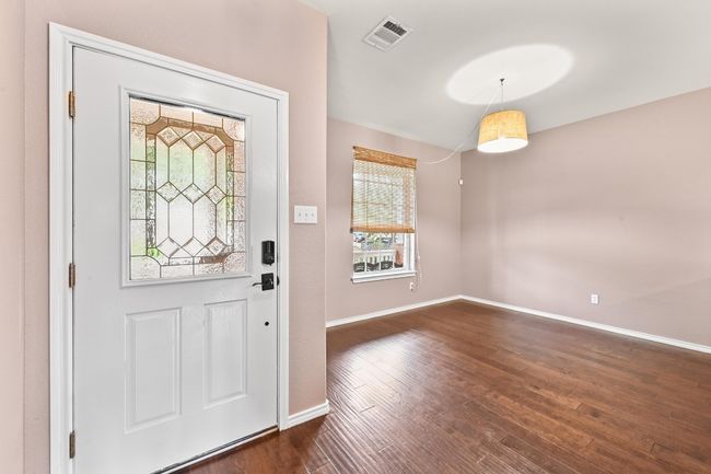 Foyer featuring baseboards and dark wood-style flooring | Image 4