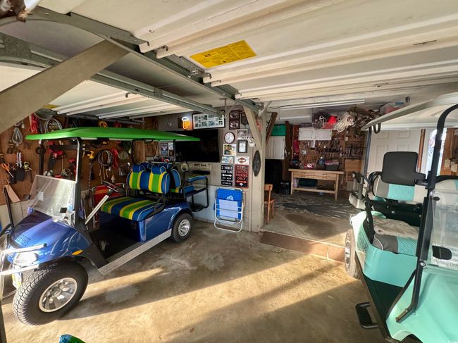 Garage with a workshop area | Image 14