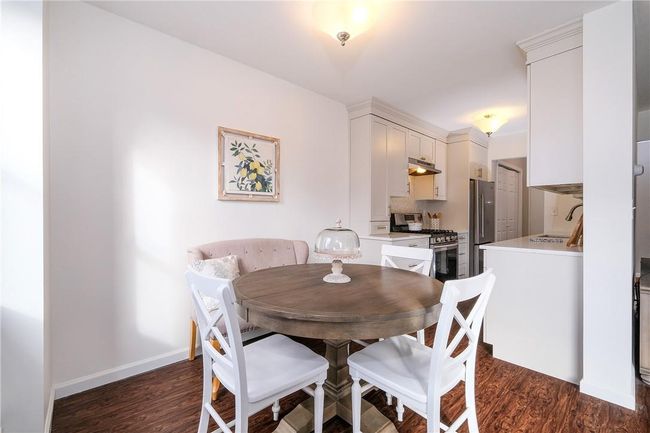 View of dining area showing flow to the kitchen. | Image 13