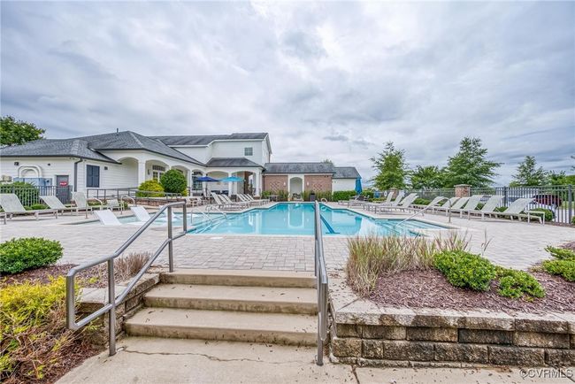 Community pool with a patio area | Image 34
