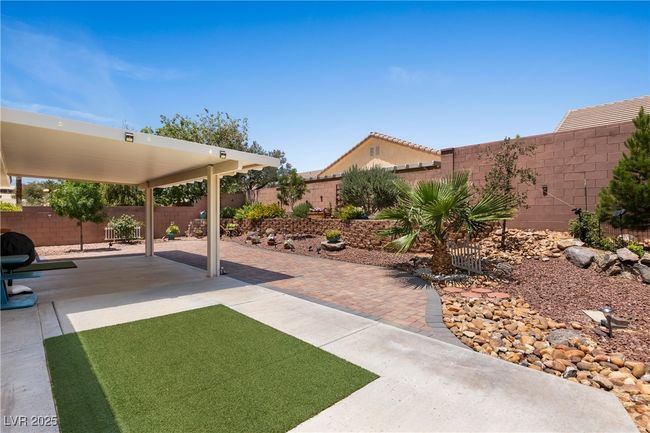 Fenced backyard featuring a patio | Image 34