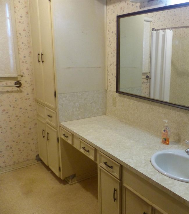 Bright and clean bathroom with timeless design. | Image 5