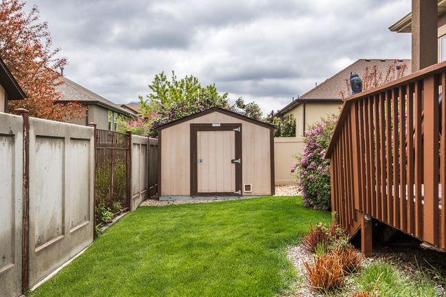View of yard with a shed and an outbuilding | Image 46