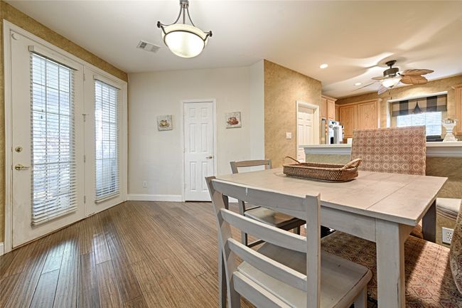 Dining room with a wealth of natural light, baseboards, visible vents, and wood finished floors | Image 30