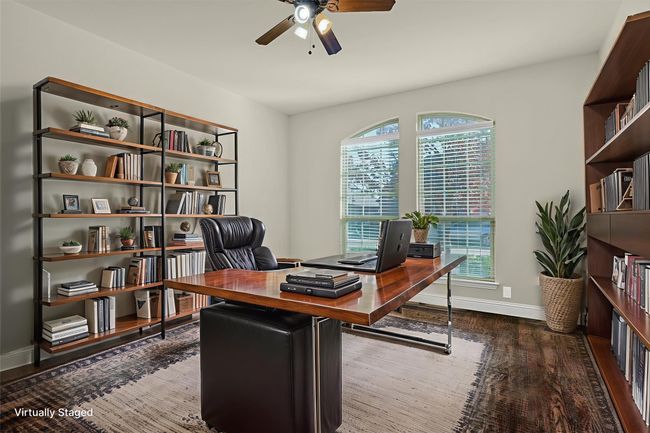Enjoy a dedicated workspace with a private office and nearby bathroom. | Image 4