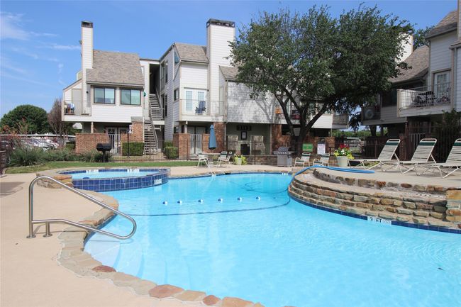 View of pool featuring a pool with connected hot tub, area for grilling, fence, and a patio | Image 25