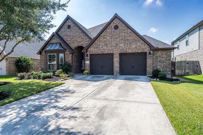 This driveway leads up to a 2-car extended garage for additional storage, and ample parking for all that visit this wonderful home! | Image 2