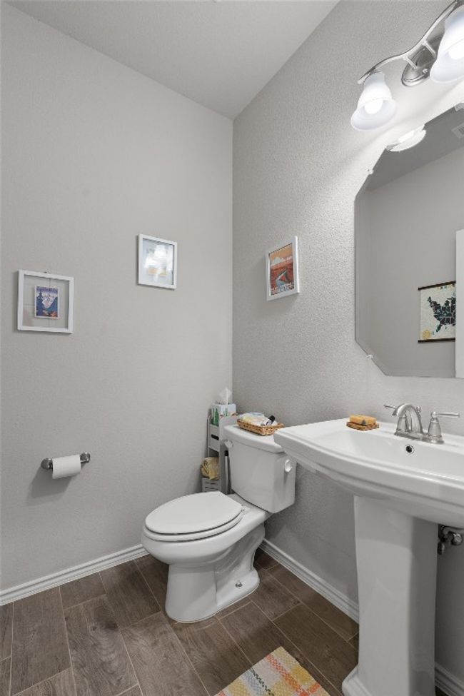 The half bath/powder room is located on the main level and is great for guests. | Image 12