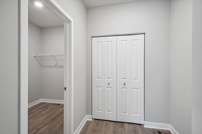 Desirable main floor bedroom with full bath. Model photo. Options and colors will vary. | Image 17