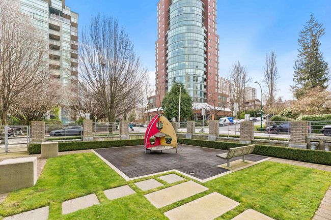View of play area with a yard and fence | Image 13
