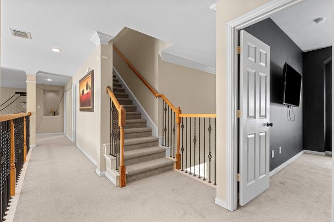 Corridor featuring carpet flooring, stairway, baseboards, recessed lighting, and ornamental molding | Image 35