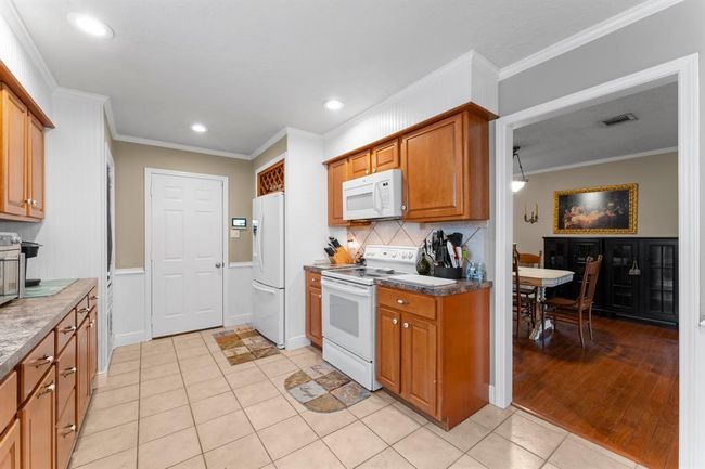 Kitchen with upgraded cabinets and tons of counter space.. | Image 10