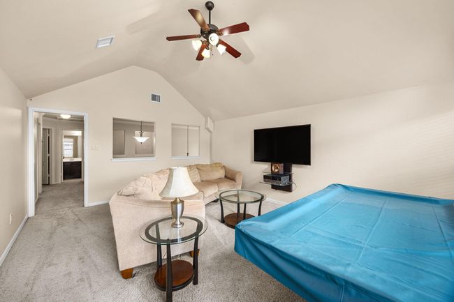 All cords are hidden for your tv space in this media room with the sound system controls. Well lit area with the cut outs overlooking the stairs. | Image 25