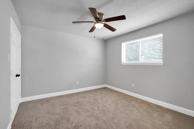 2nd Bedroom with new carpet, paint, fan and blinds | Image 16