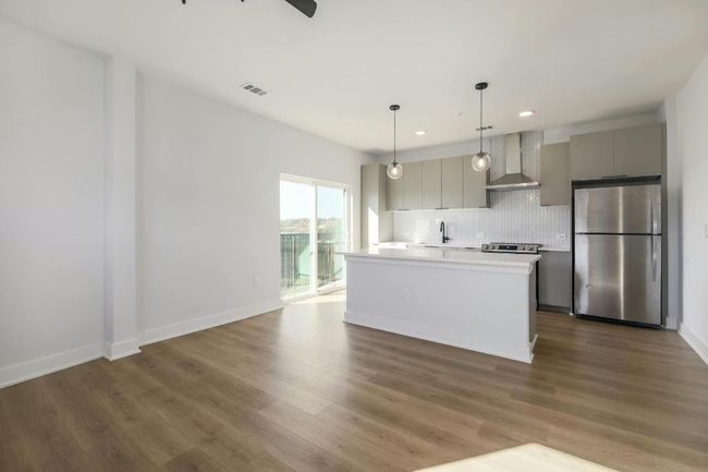 Open floor plan - kitchen and living room view | Image 9