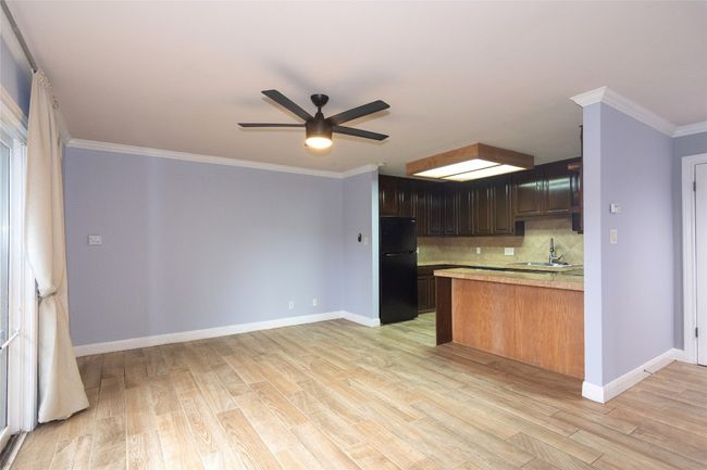 View to Kitchen from Living area, tile flooring | Image 6