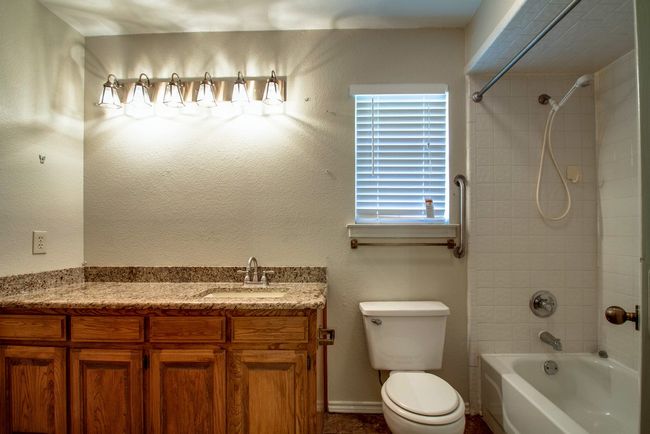 Bathroom with shower combination and vanity | Image 18
