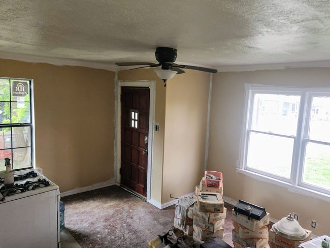 Foyer with baseboards, a ceiling fan, and a textured ceiling | Image 11