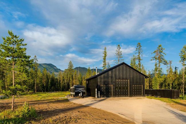 View of outbuilding featuring a forest view and a mountain view | Image 8