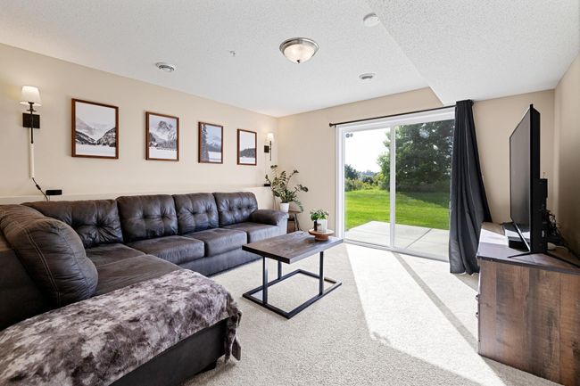 Walk-out basement features additional bedroom and 3/4 bathroom + laundry/utility room and under-the-stairs storage room. | Image 24