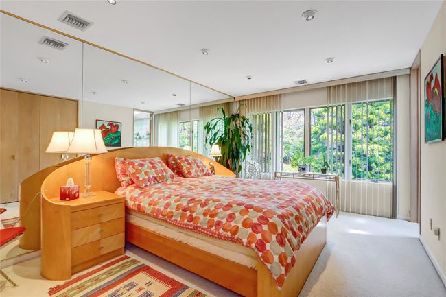 Bedroom with visible vents and light colored carpet | Image 19