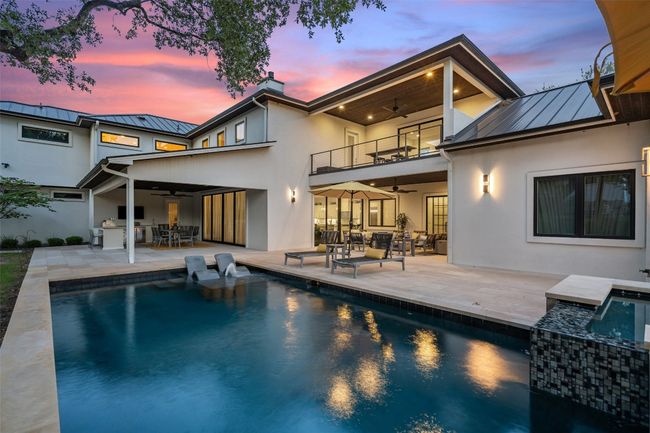 Poolside luxury meets architectural symmetry with two elegant outdoor living spaces - a backyard built for entertaining. | Image 39