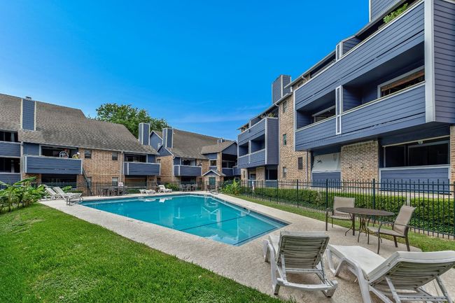 Community pool featuring a patio and a residential view | Image 25