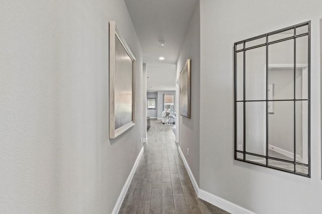 Hall with wood finished floors and recessed lighting | Image 19