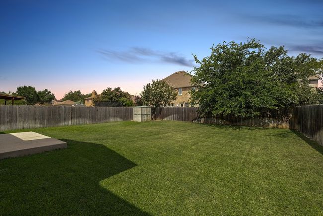 A large backyard offers endless potential to build a pool, outdoor kitchen, or play area. | Image 23