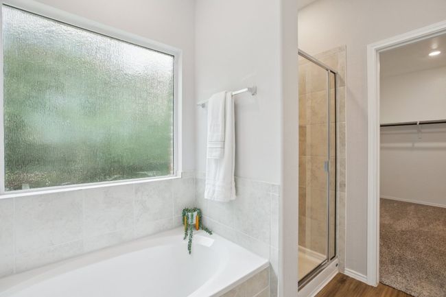Tub, shower and walk-in closet. | Image 14