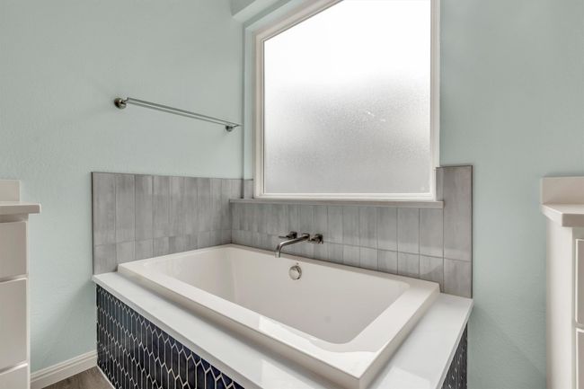 Bathroom featuring a bath | Image 30