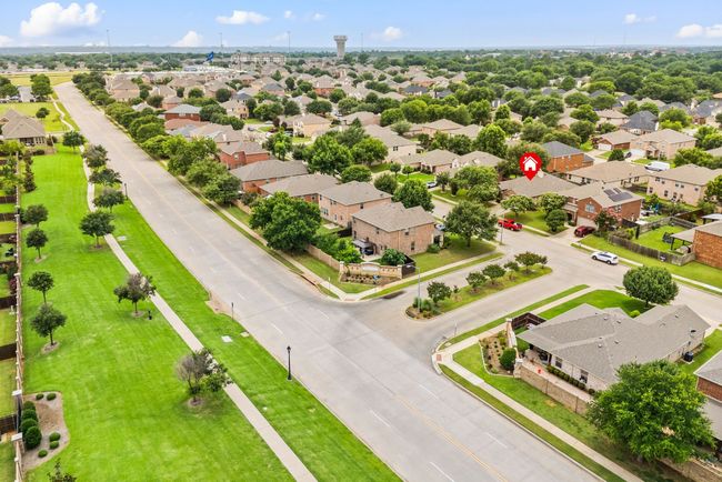 Direct overhead aerial shot showing the full roof layout and ample yard space surrounding the home. | Image 38
