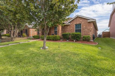 View of front of house with central AC unit and a front yard | Image 3