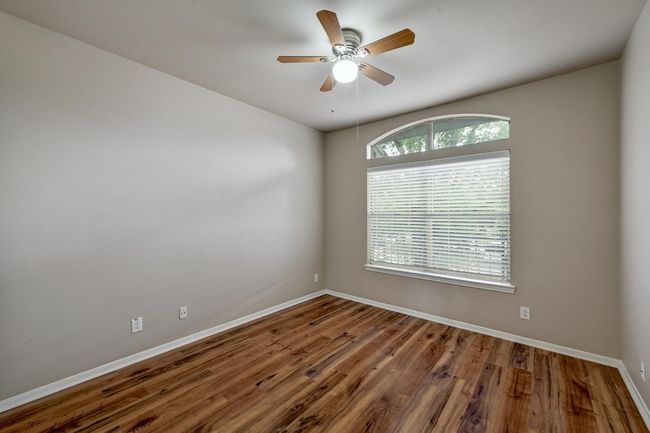 Unfurnished room featuring a ceiling fan and wood finished floors | Image 20