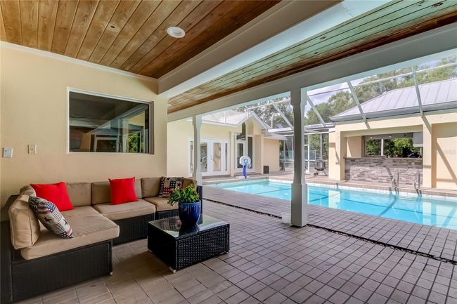 Covered area overlooking pool | Image 44