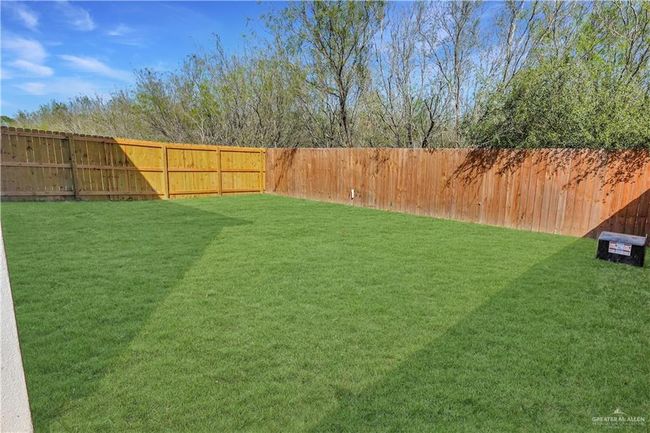 View of yard with a fenced backyard | Image 20